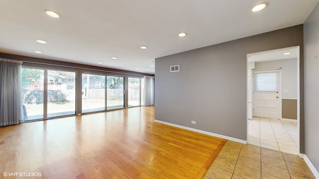 empty room with light hardwood / wood-style floors