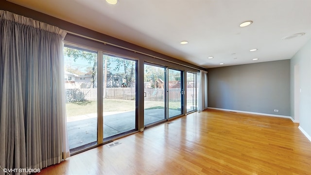 unfurnished room featuring hardwood / wood-style floors