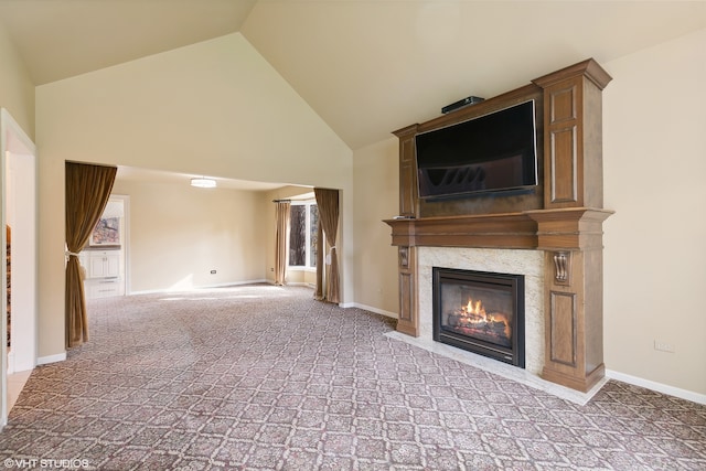 unfurnished living room with light carpet, a fireplace, and high vaulted ceiling