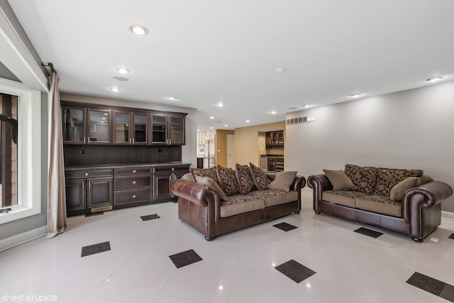 tiled living room featuring a barn door