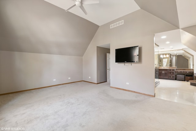 additional living space featuring ceiling fan, lofted ceiling, and light colored carpet