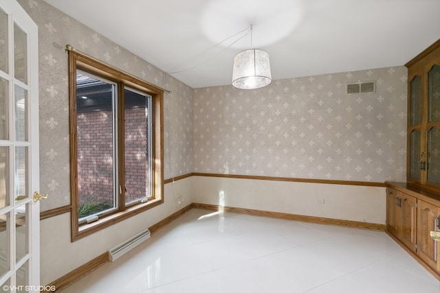 unfurnished room with light tile patterned flooring