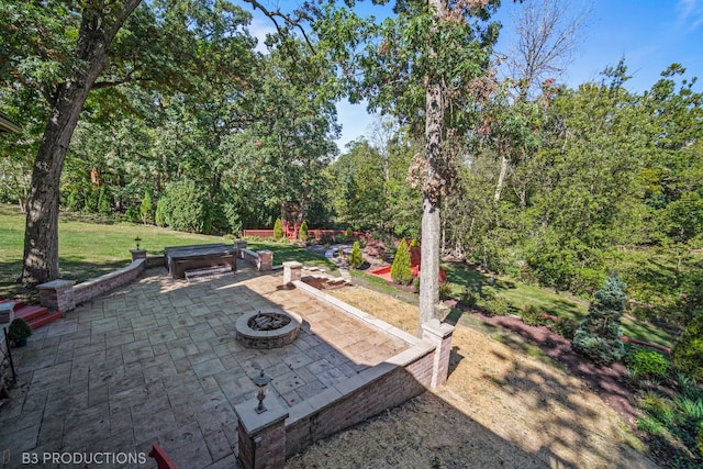 view of patio featuring an outdoor fire pit