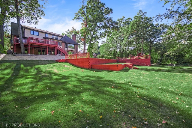 view of yard with a wooden deck