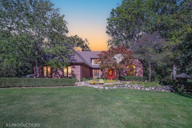 view of front of property with a yard