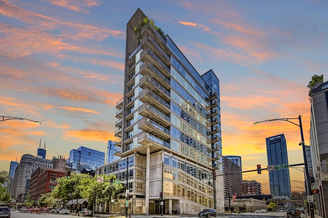 view of outdoor building at dusk