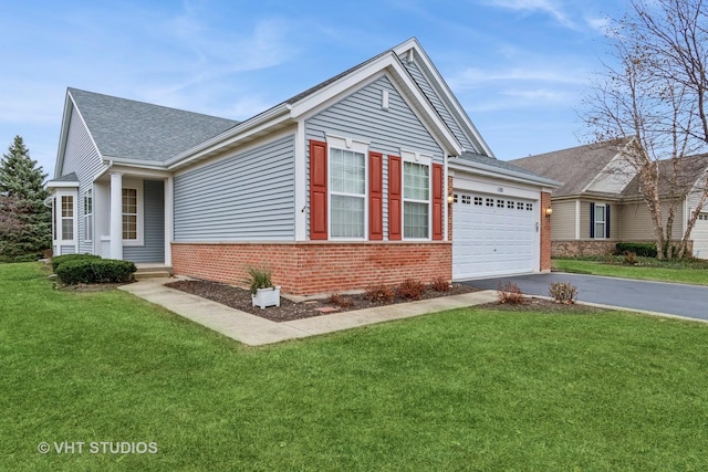 view of front facade with a front yard and a garage