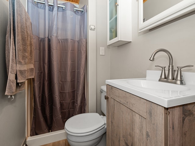 bathroom with vanity, toilet, wood-type flooring, and a shower with shower curtain