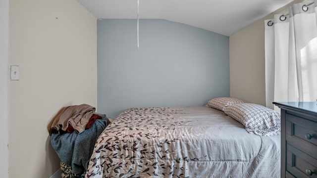 bedroom featuring vaulted ceiling