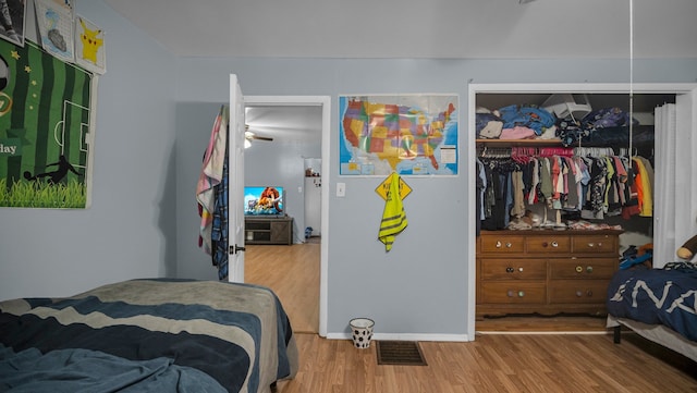 bedroom featuring light wood-type flooring and a closet