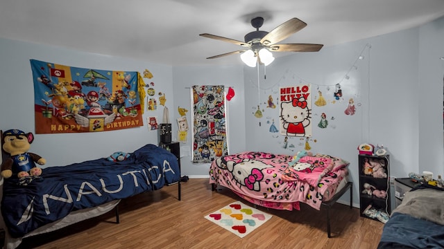 bedroom featuring hardwood / wood-style floors and ceiling fan