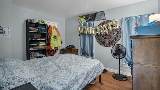 bedroom with hardwood / wood-style floors