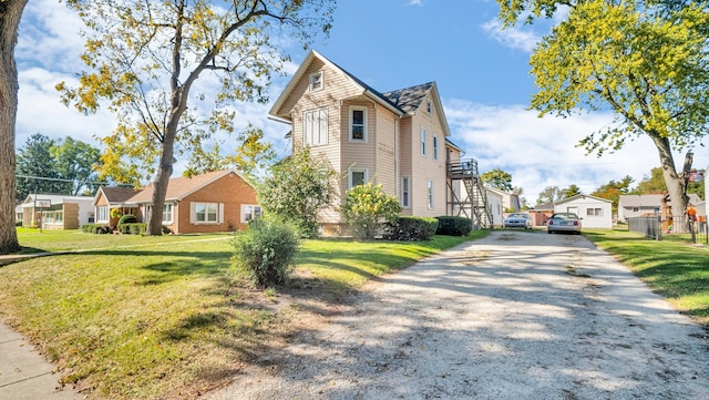 view of property exterior with a yard