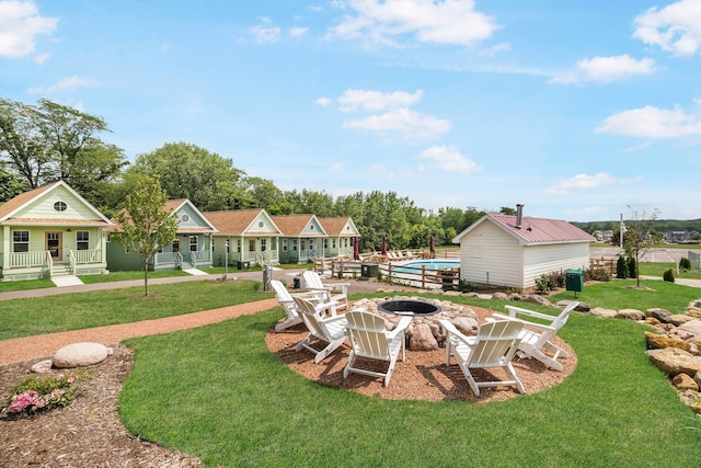 view of yard with a fire pit