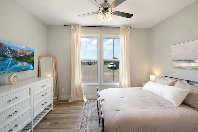 bedroom featuring ceiling fan and light wood-type flooring