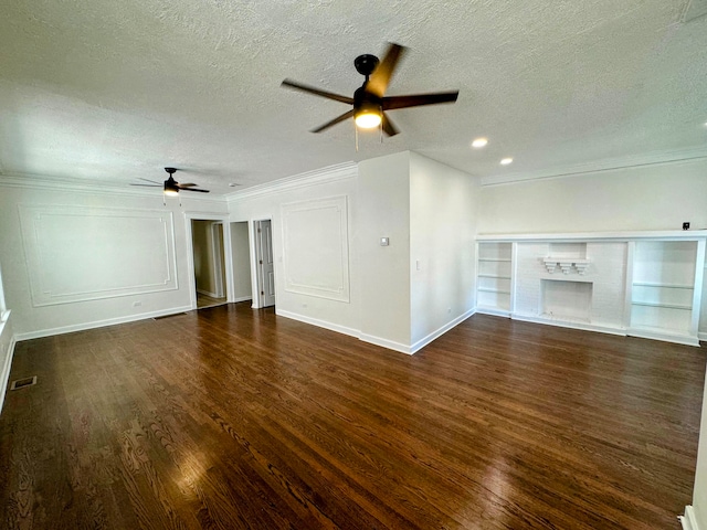 unfurnished living room featuring ceiling fan, dark hardwood / wood-style flooring, ornamental molding, and a textured ceiling