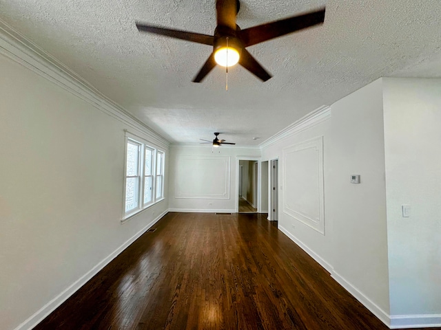 empty room with ceiling fan, a textured ceiling, crown molding, and dark wood-type flooring