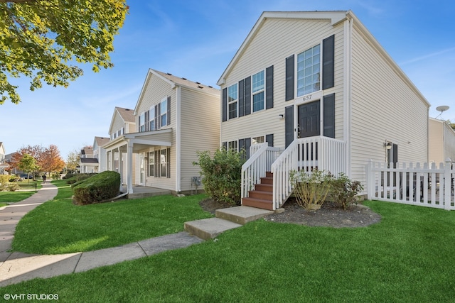 view of front of house with a front lawn