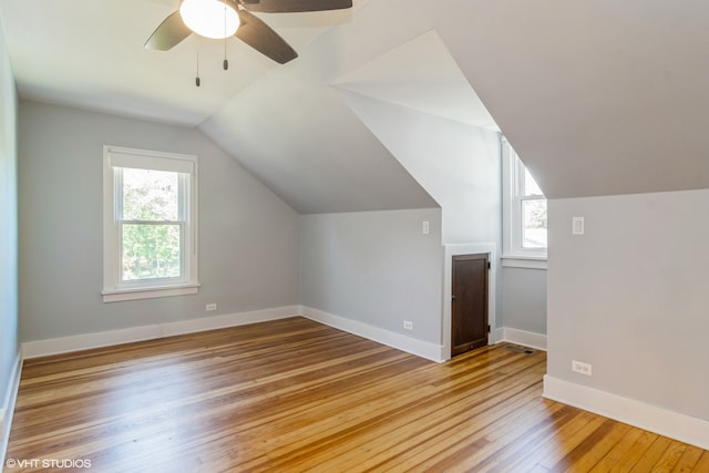 bonus room featuring ceiling fan, light wood-type flooring, and lofted ceiling