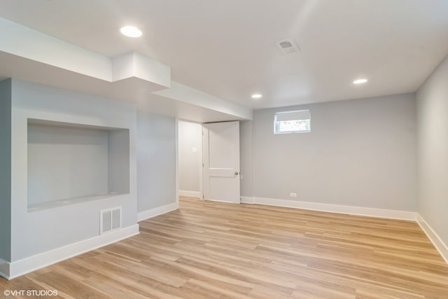 basement featuring light hardwood / wood-style floors