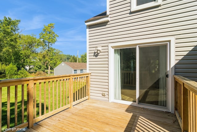 wooden terrace with a yard