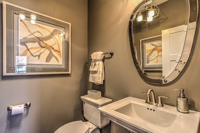 bathroom with sink and toilet