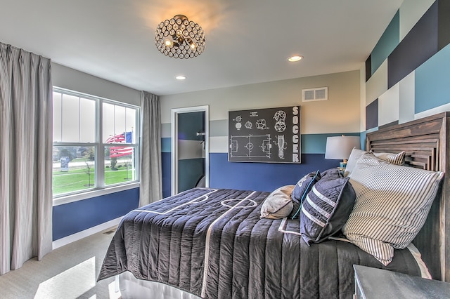 bedroom featuring light carpet