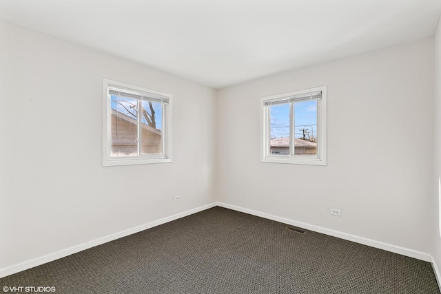 spare room featuring carpet