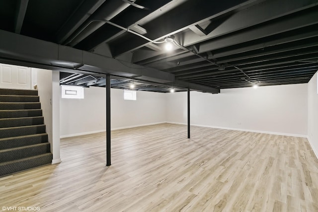 basement featuring light hardwood / wood-style floors