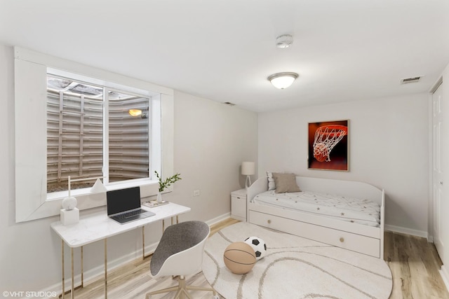 bedroom featuring light wood-type flooring