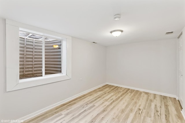 empty room with light hardwood / wood-style floors