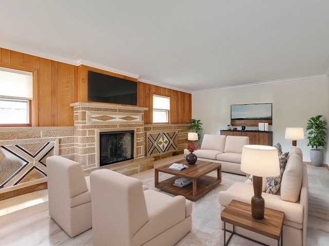 living room with hardwood / wood-style floors, wooden walls, and crown molding