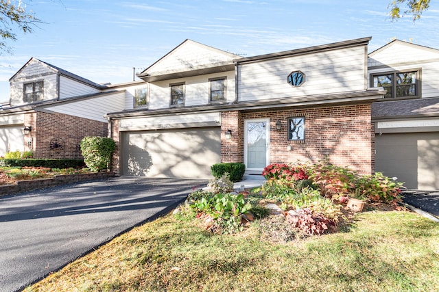 townhome / multi-family property featuring a garage