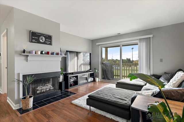 living room with dark hardwood / wood-style flooring