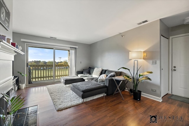 living room featuring dark hardwood / wood-style flooring