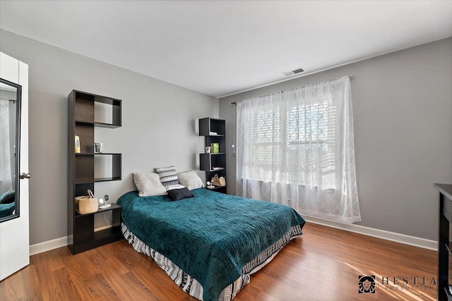 bedroom featuring wood-type flooring