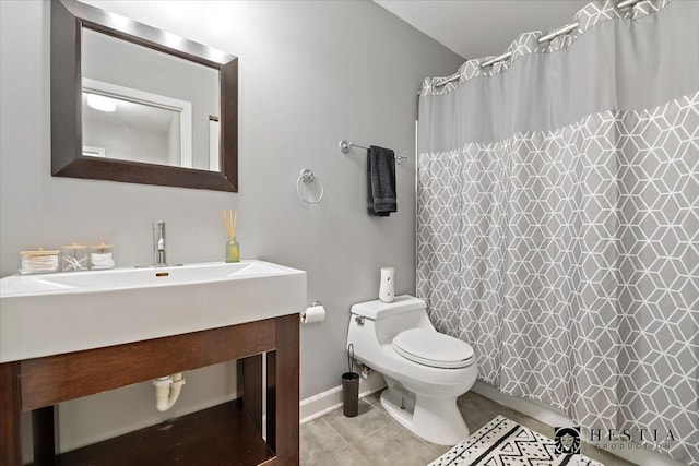 bathroom featuring vanity, toilet, tile patterned floors, and a shower with shower curtain