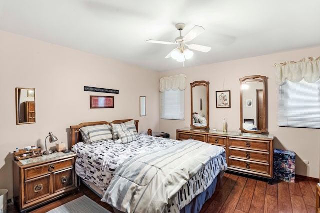 bedroom featuring dark hardwood / wood-style floors and ceiling fan