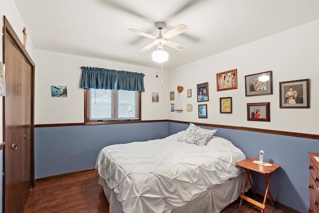 bedroom featuring dark wood-type flooring and ceiling fan