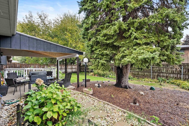 view of yard featuring an outdoor living space and a patio