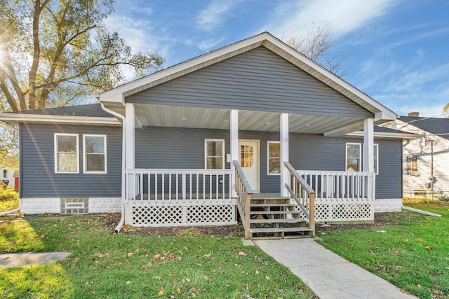 view of front of house featuring a porch and a front yard