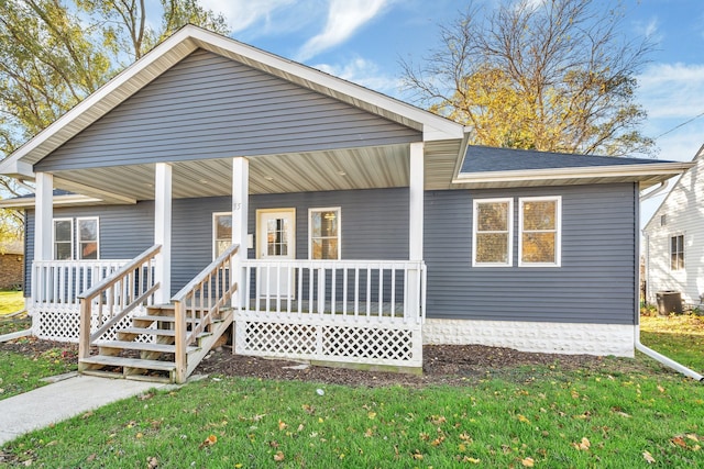 view of front facade with a front lawn and a porch