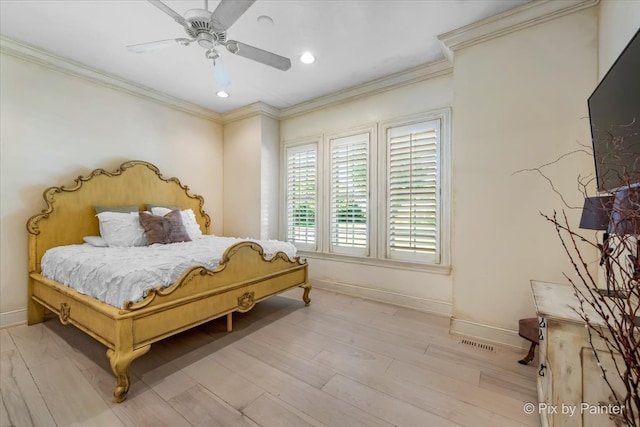 bedroom featuring ornamental molding, light wood-type flooring, and ceiling fan