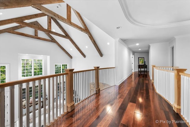 hallway featuring beamed ceiling, crown molding, dark wood-type flooring, and high vaulted ceiling