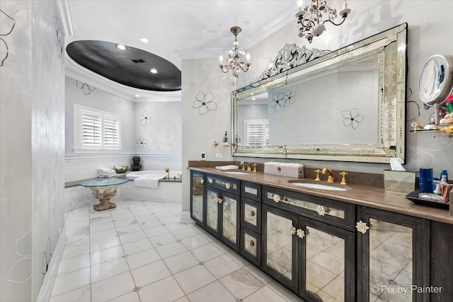 bathroom with vanity, a bathing tub, and crown molding