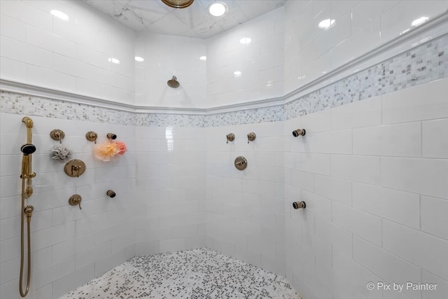 bathroom with tiled shower