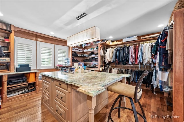 spacious closet featuring light hardwood / wood-style flooring