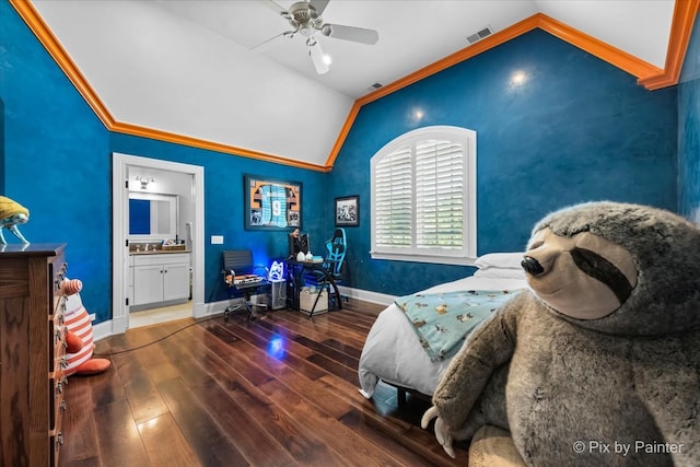 bedroom featuring ceiling fan, hardwood / wood-style flooring, vaulted ceiling, ornamental molding, and ensuite bathroom