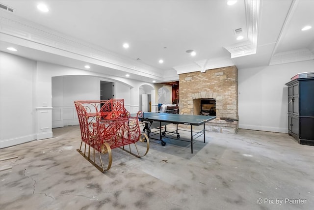 playroom with a stone fireplace