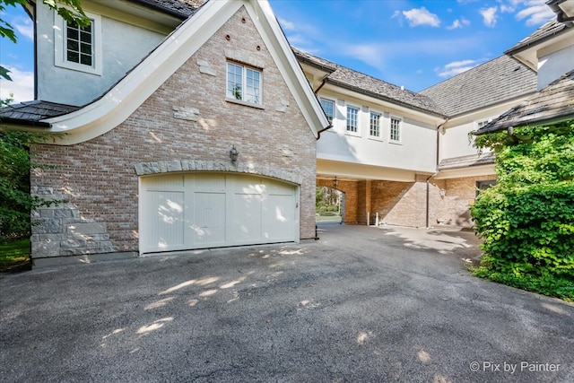 view of property exterior with a garage